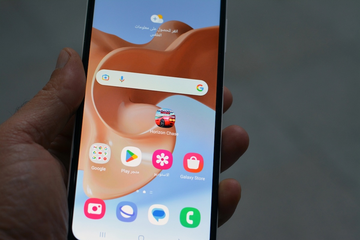 An android phone in someone's hand.